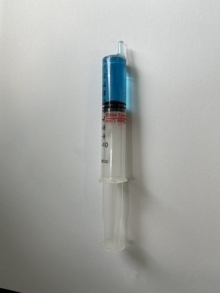 Clear label in use on syringe